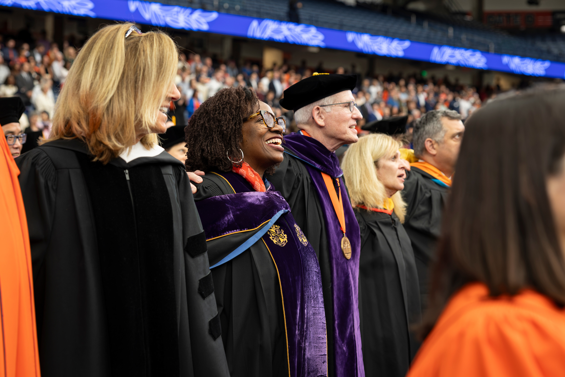 Members of the Chancellor's executive team join in the singing of the alma mater.