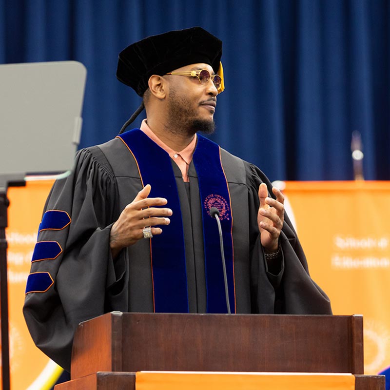 Carmelo Anthony speaking at Commencement 2025