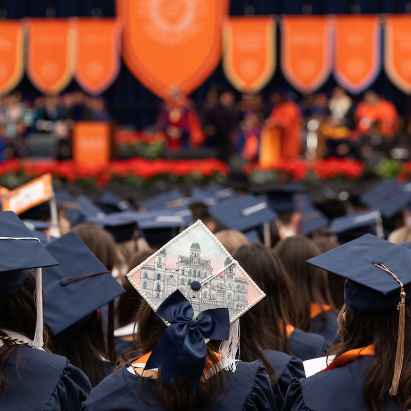 Student watching the Commencement Speaker