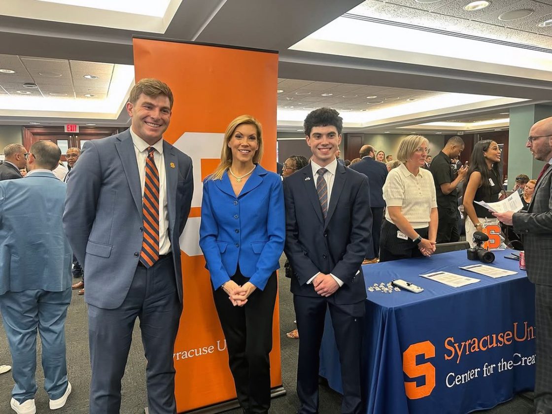 Cameron MacPherson, U.S. Representative Beth Van Duyne and Thomas O'Brien pose at Creator Row, creator gathering organized by the Congressional Creators Caucus