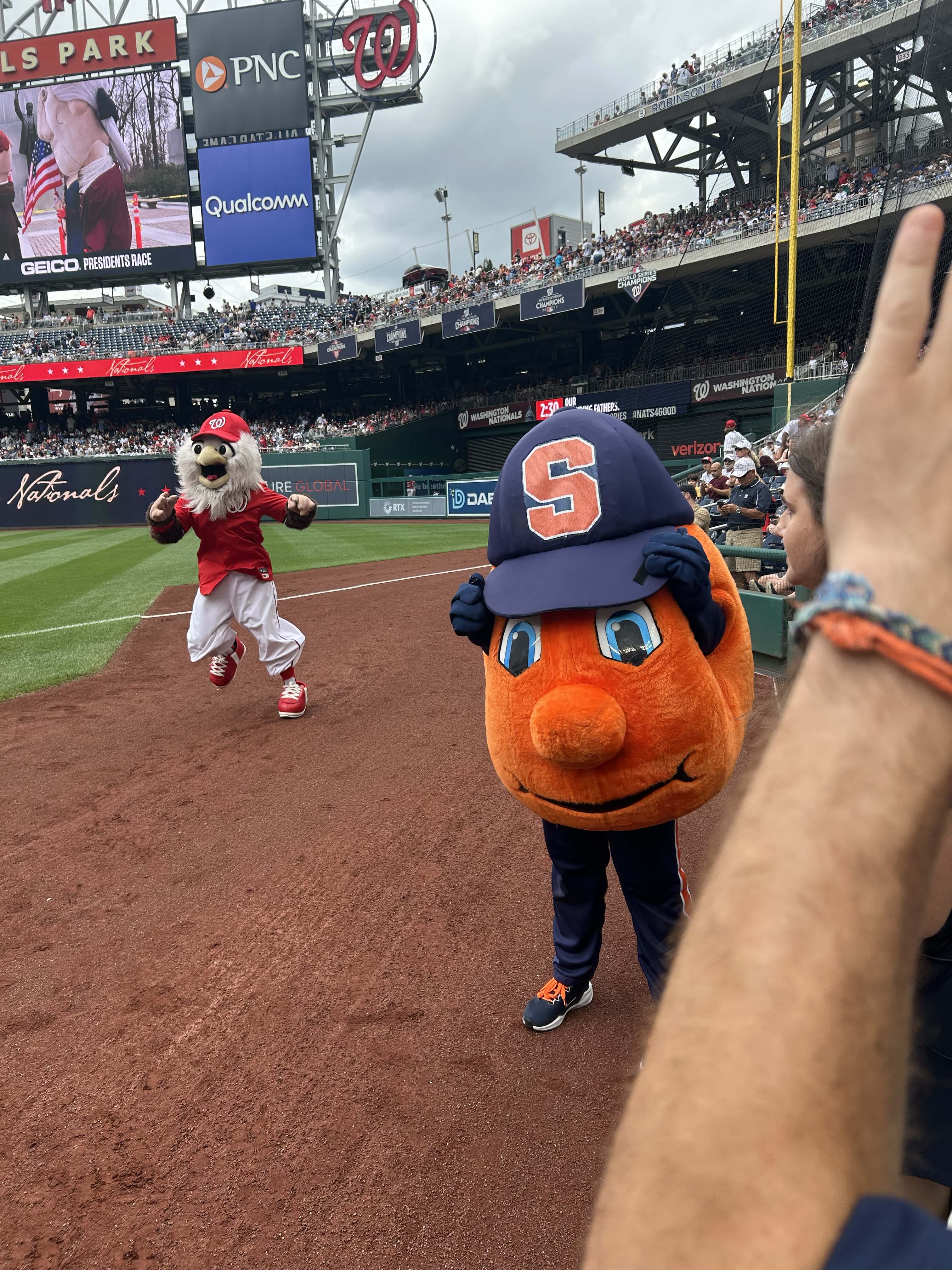 Otto posing with nationals baseball mascot.