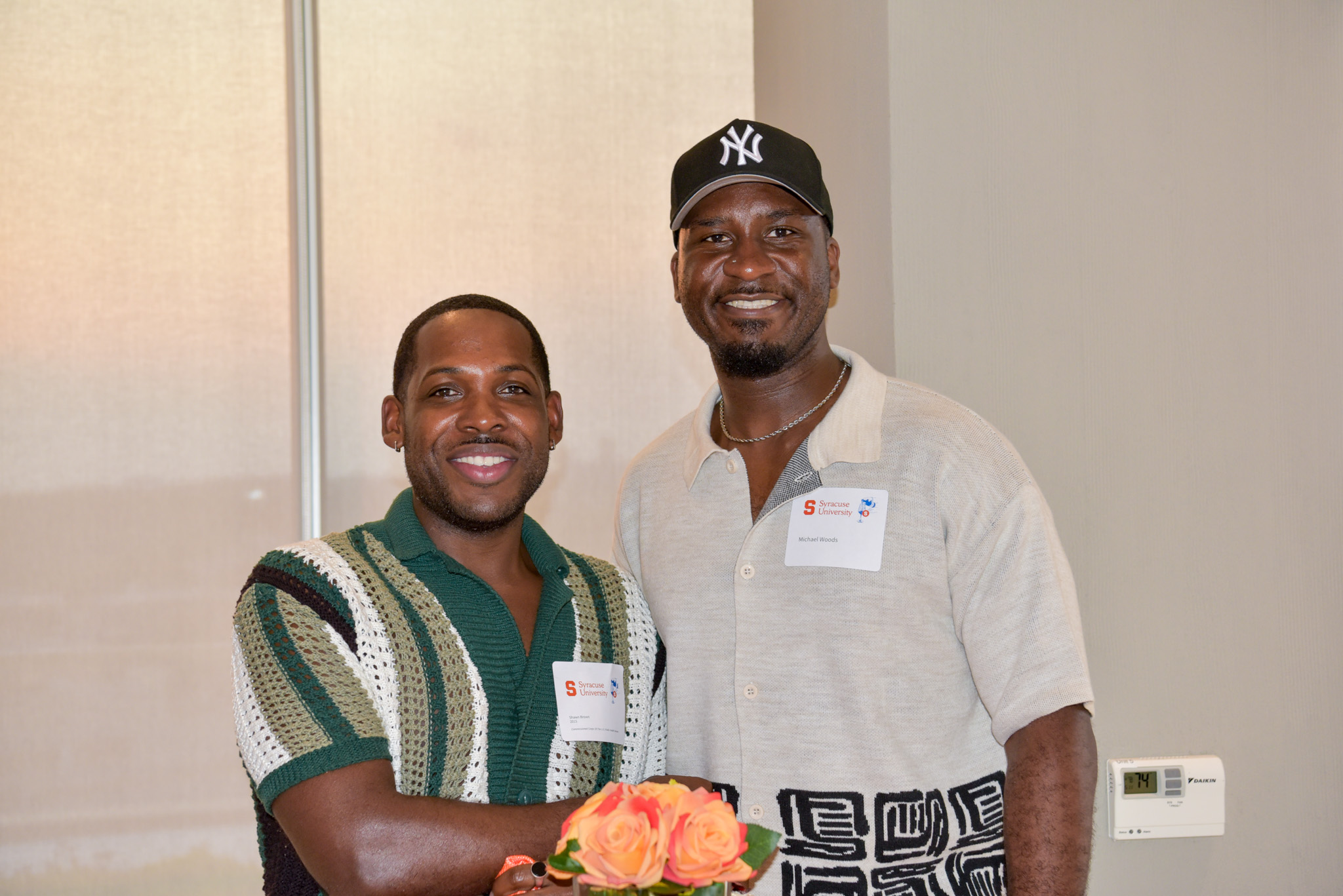two people posing for photo at wine appreciation.