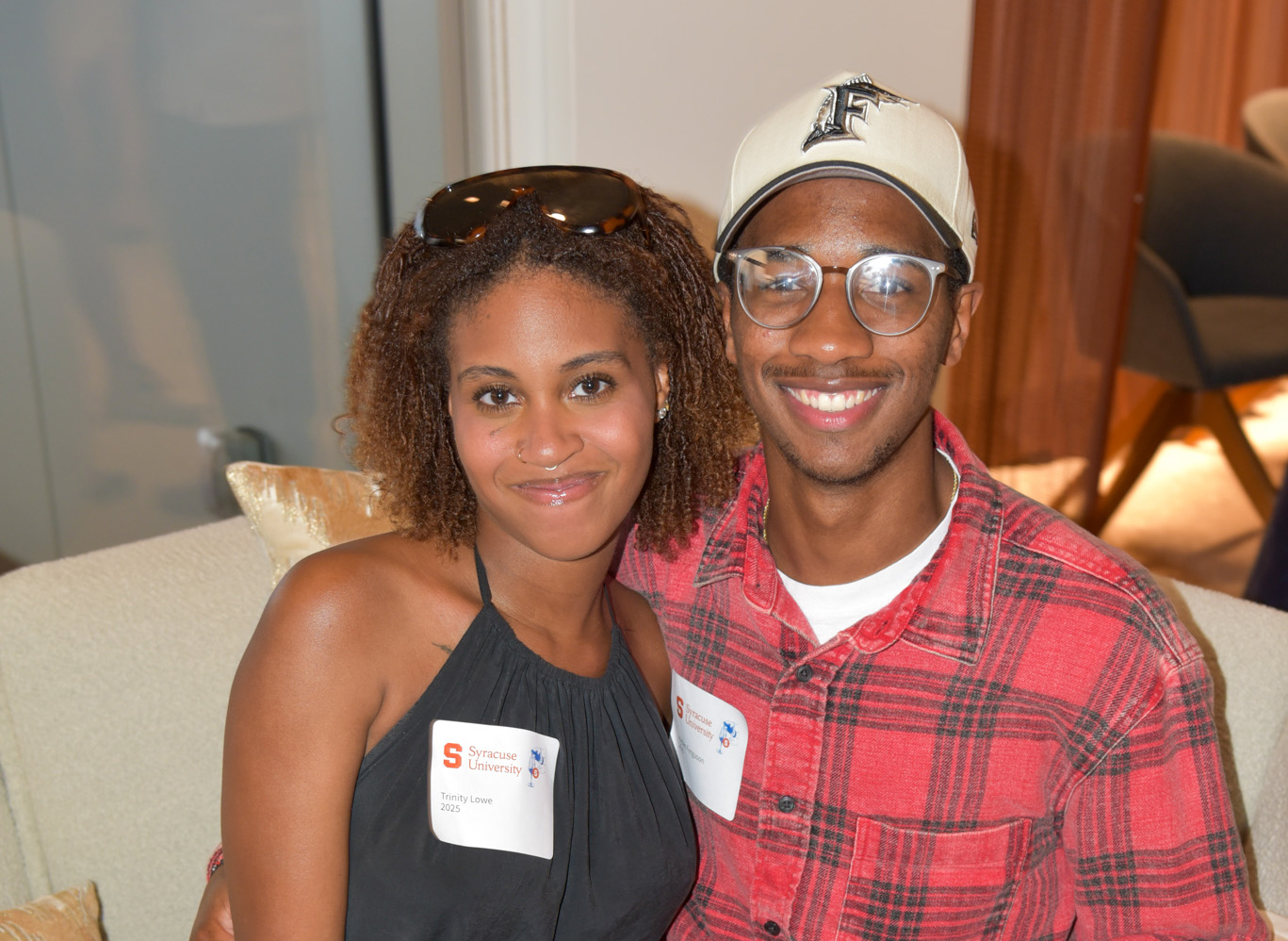 Two people posing for photo at wine appreciation in SU DC.