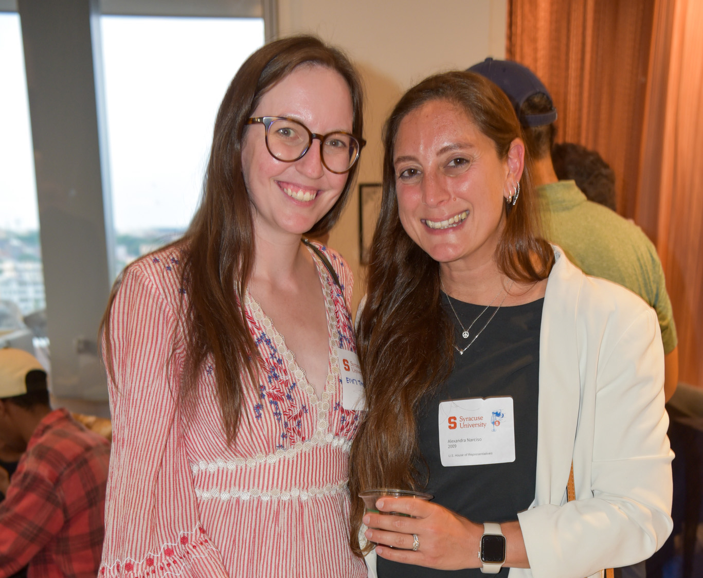 Two people posing for photo at wine appreciation in SU DC.