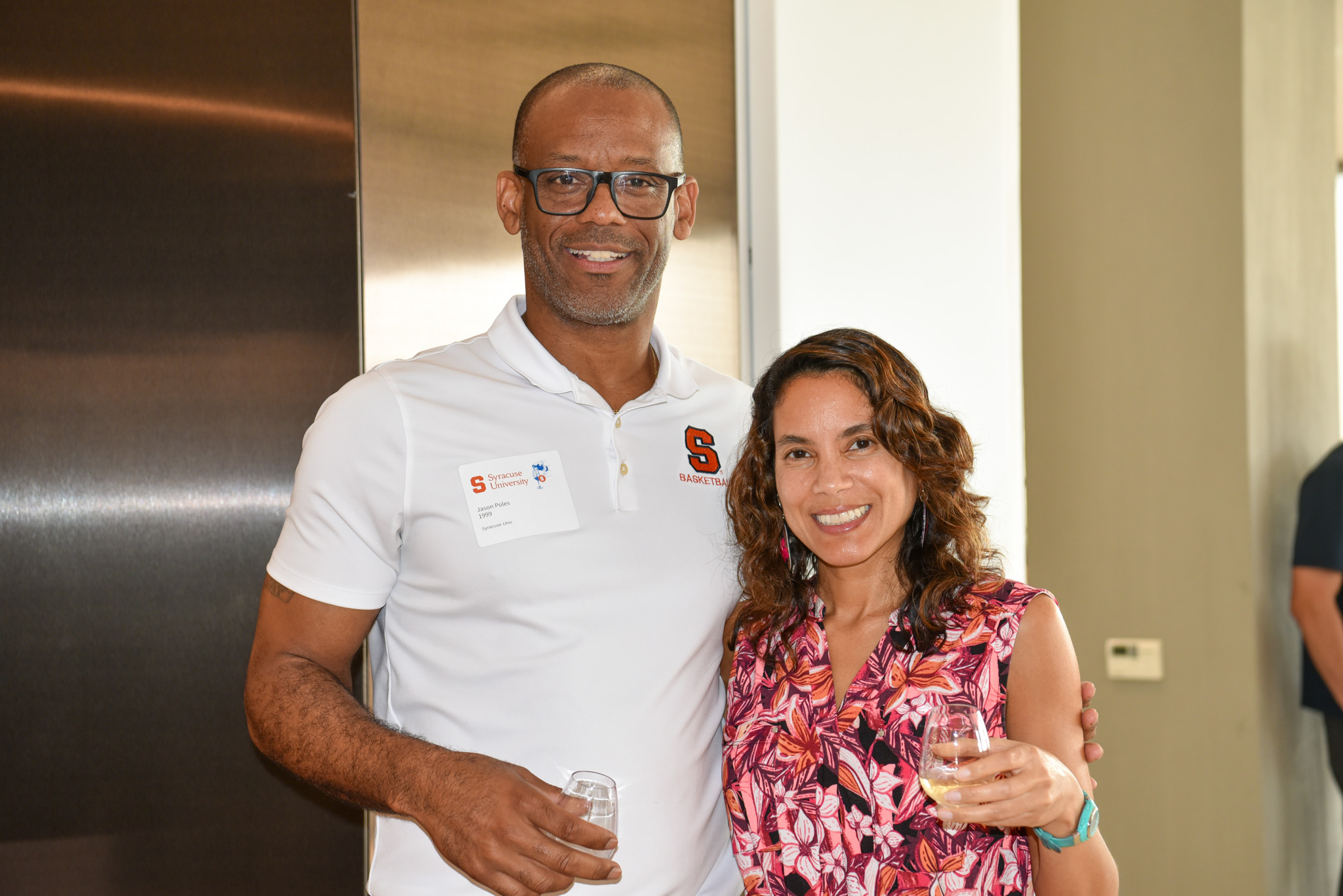 Two people posing for photo at wine appreciation in SU DC.