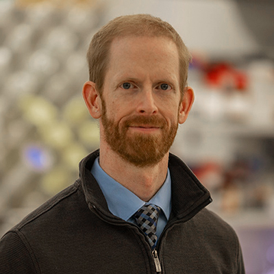 A man with short red hair and a beard. 