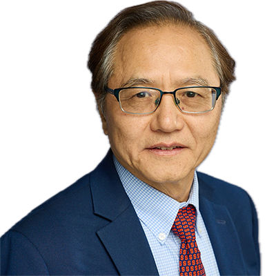 A man with thinning brown hair, wearing glasses and navy blue suit with a red tie.