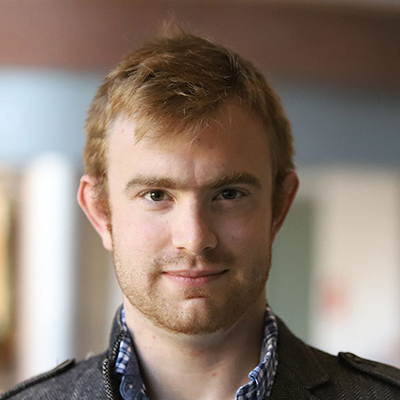 A man with short red hair.