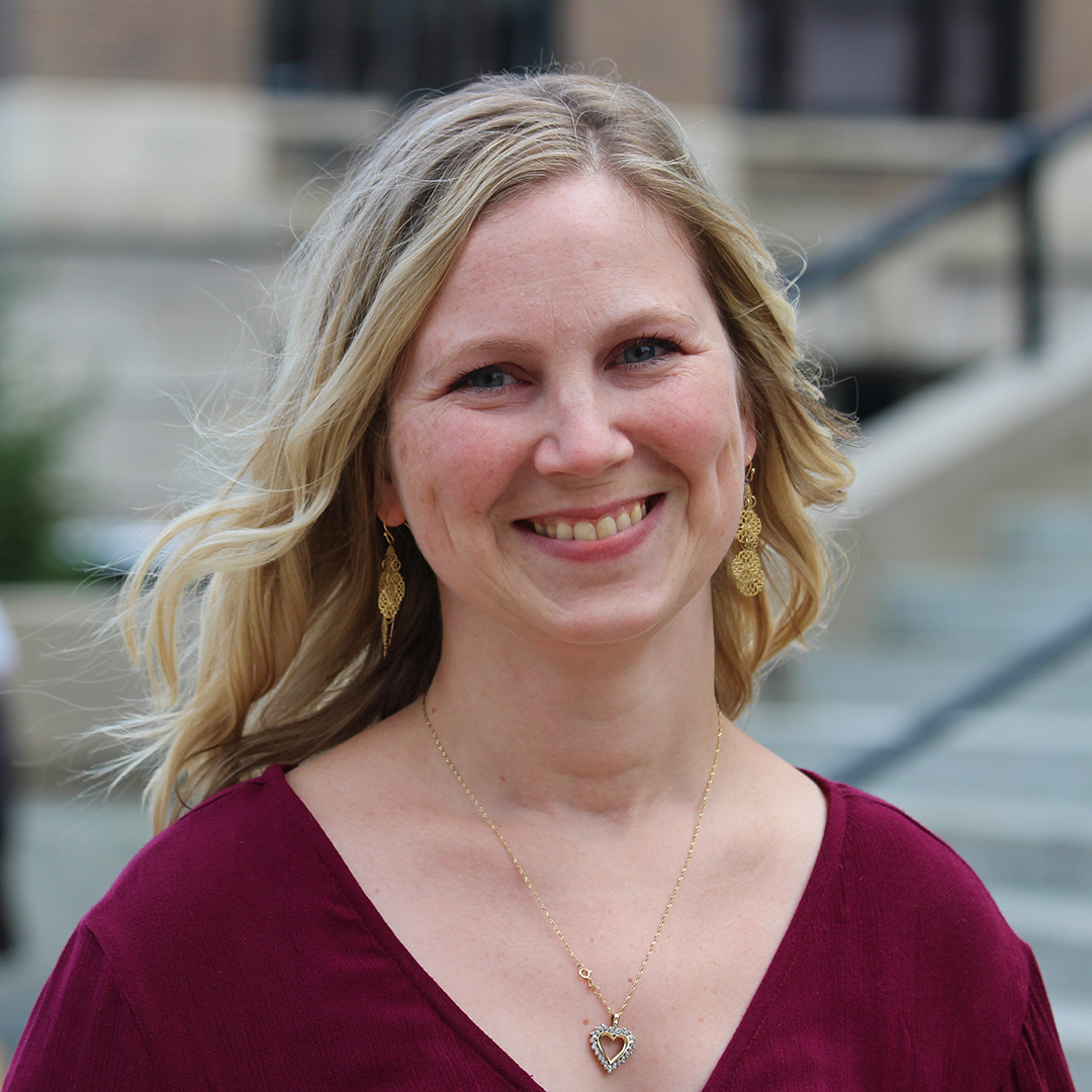 A woman smiling.