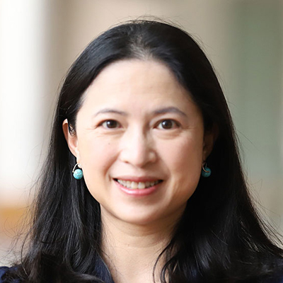 A woman with long dark hair.