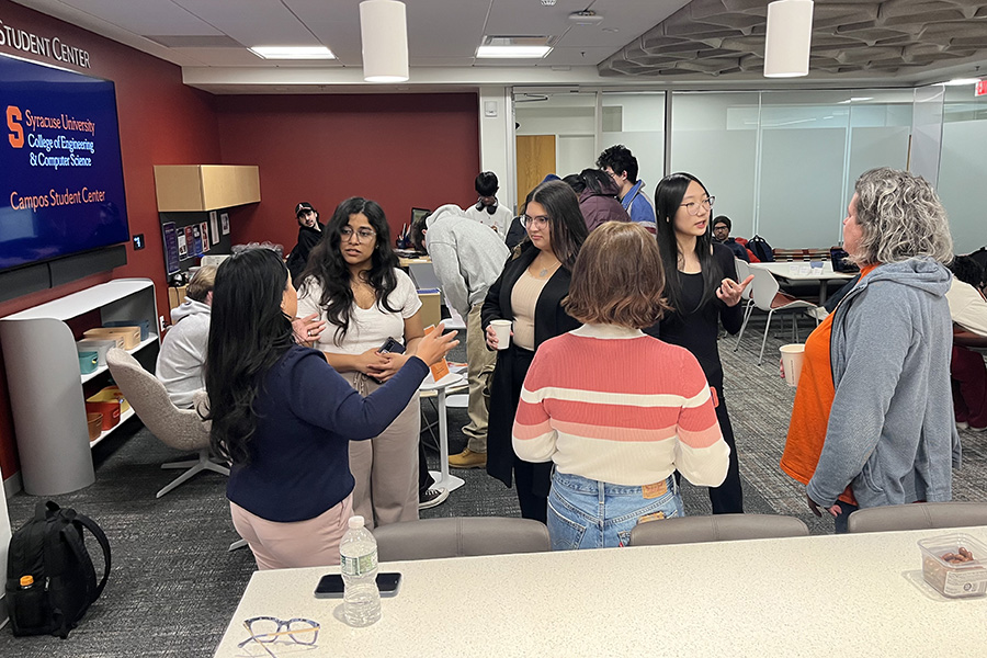 Students and alumni interacting at a networking event