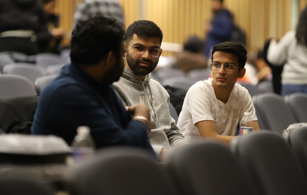 Students working on a software development challenge