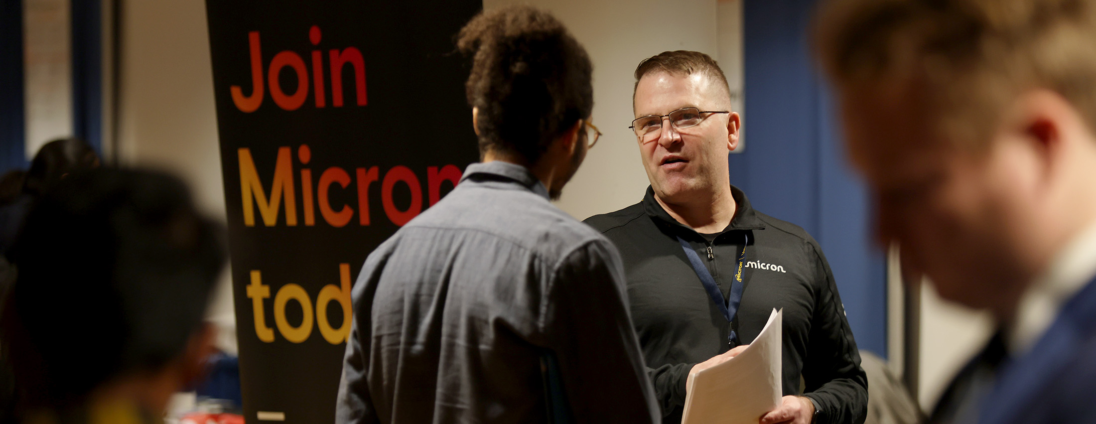 A student meeting with an employer at a career fair
