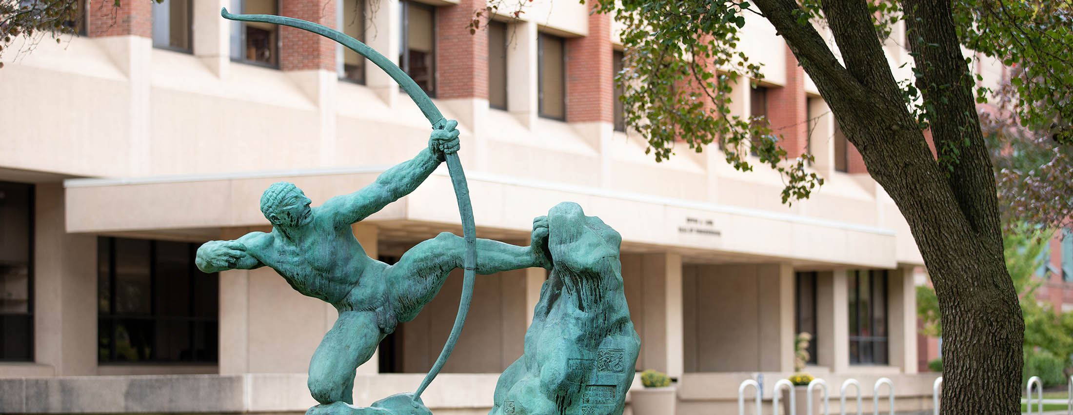 A Bronze statue entitled “Herakles” by Emile Bourdelle sits in front of Link Hall and depicts an archer drawing back his bow.