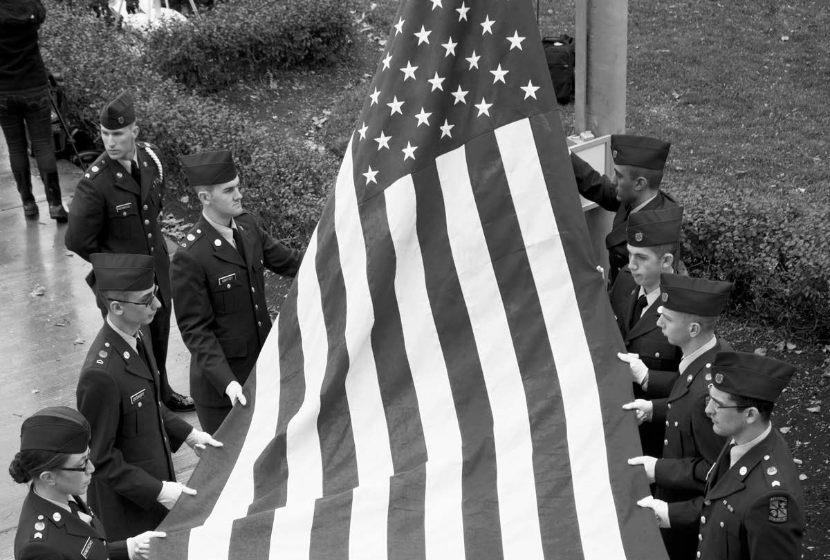 Veterans folding US Flag