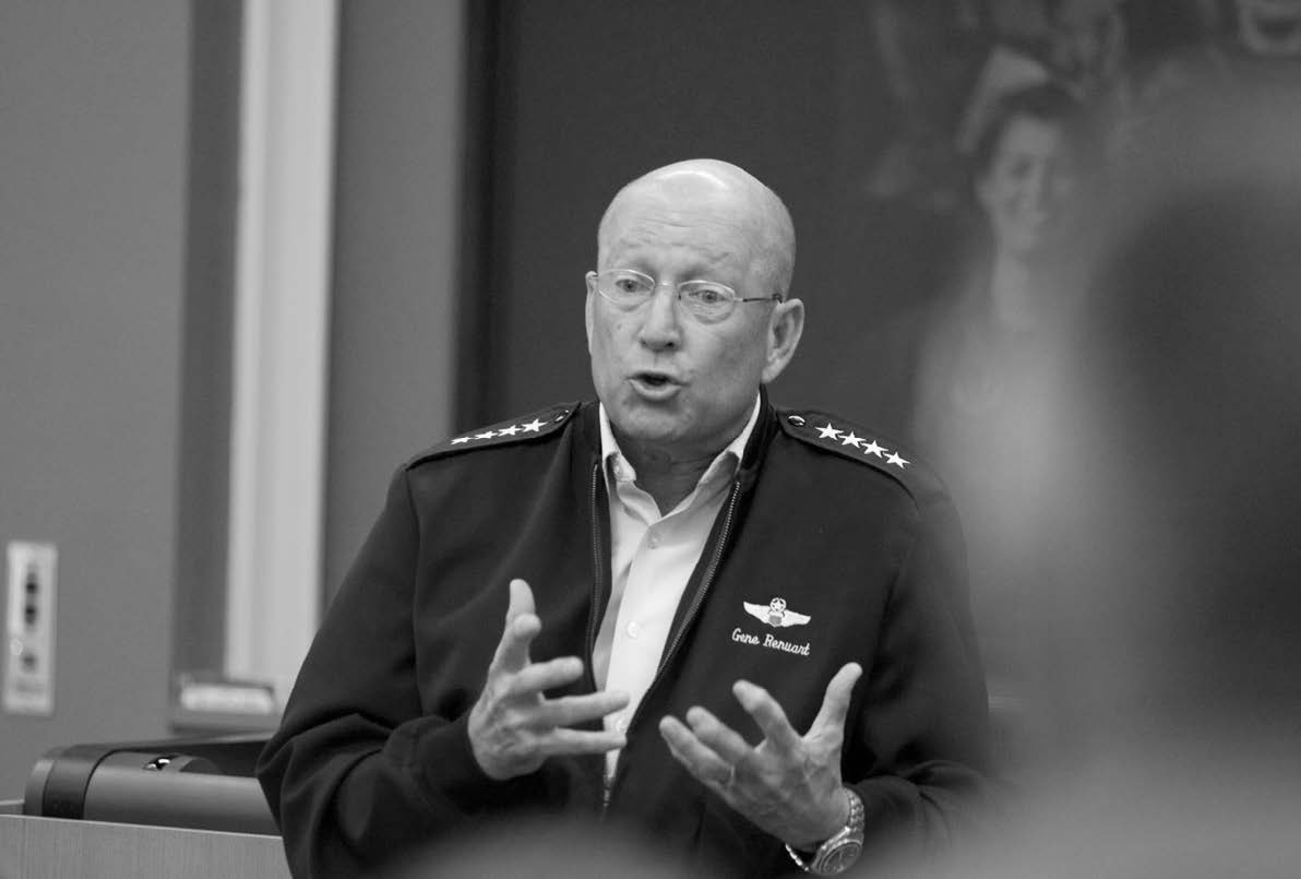 Four-star general with shirt unbuttoned talking