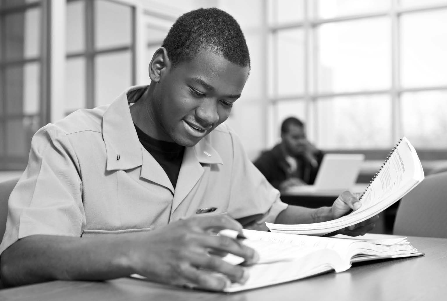 African American Veteran with book, pencil and paper