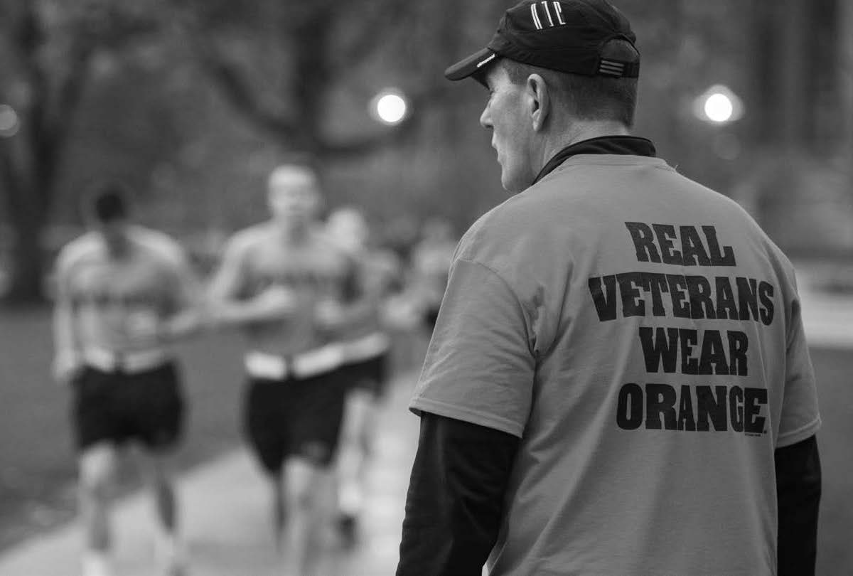 Coach watching military students doing physical training