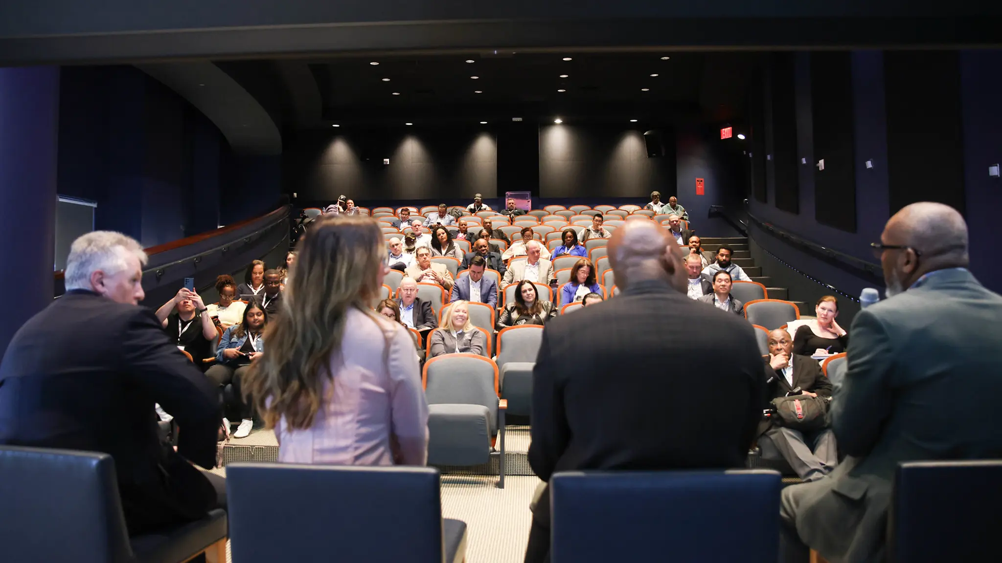 From behind a panel of 4 seated speakers on stage at MEF NYC 2026, attendees the small, nearly-filled auditorium listens. 