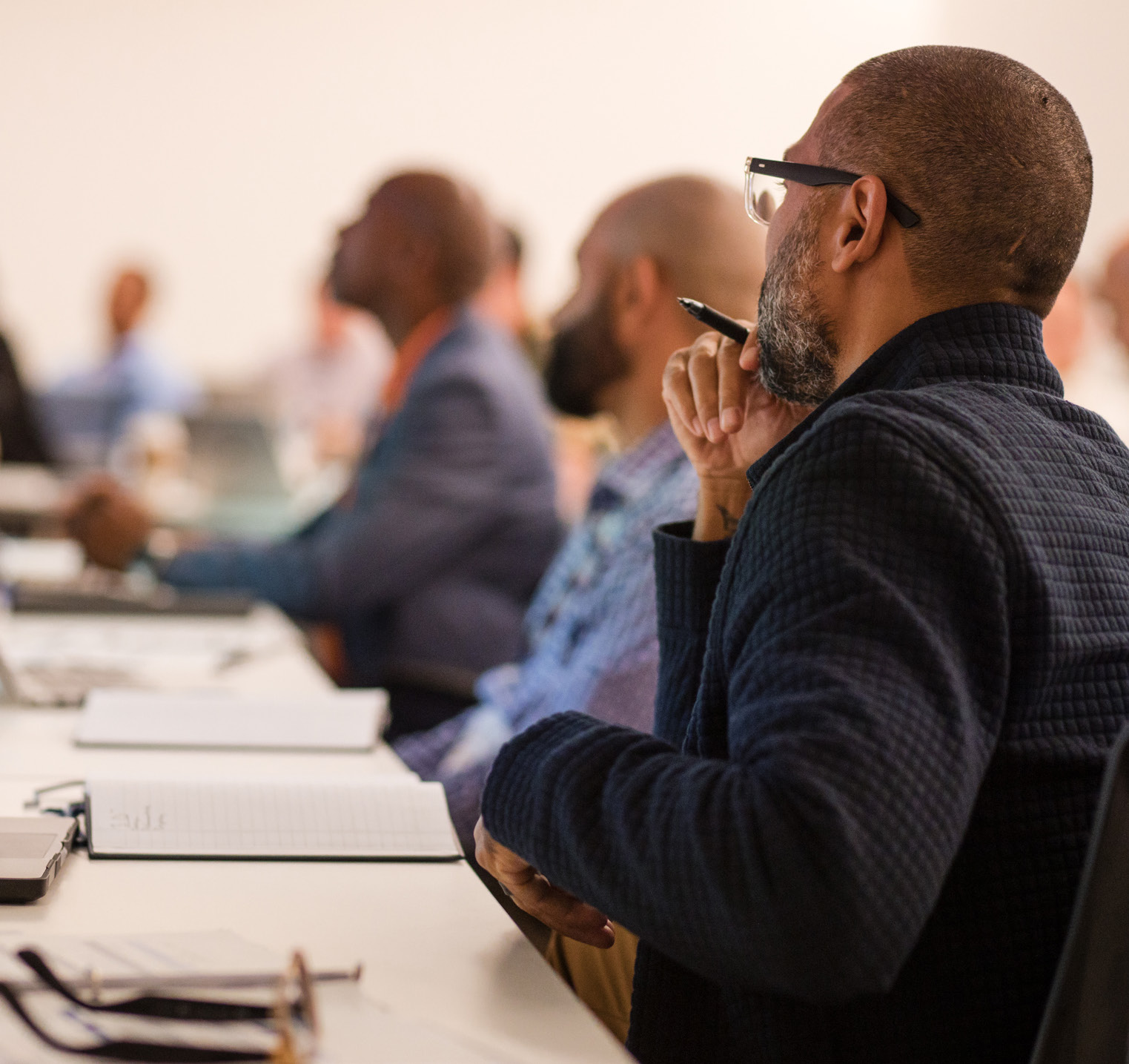 Back of a person attending a meeting