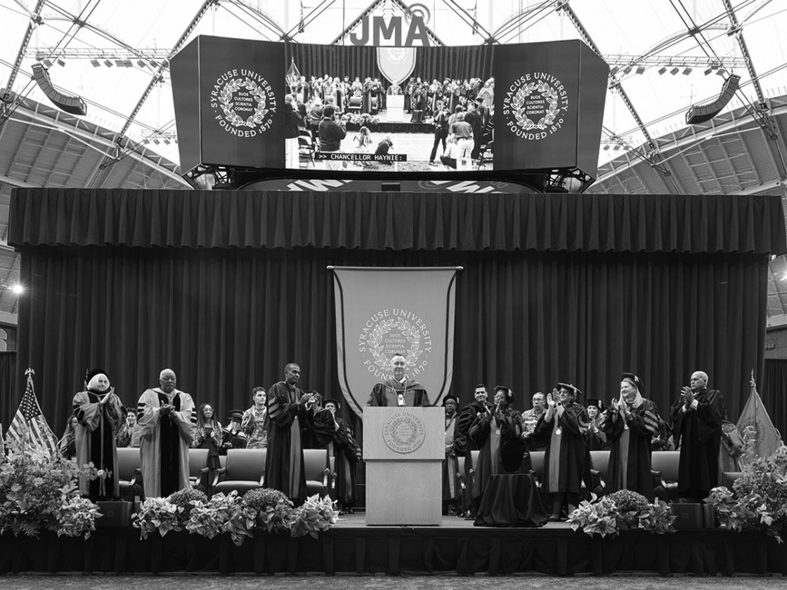 Dr Mike Haynie at Syracuse University's coronation giving a speech. 