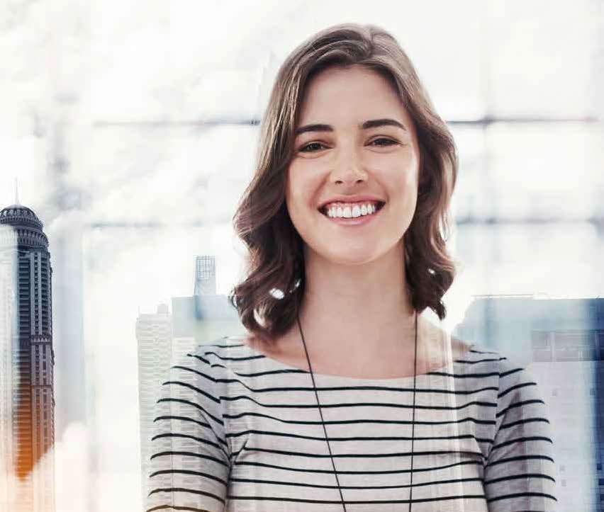 Military spouse smiling and crossing her arms. 