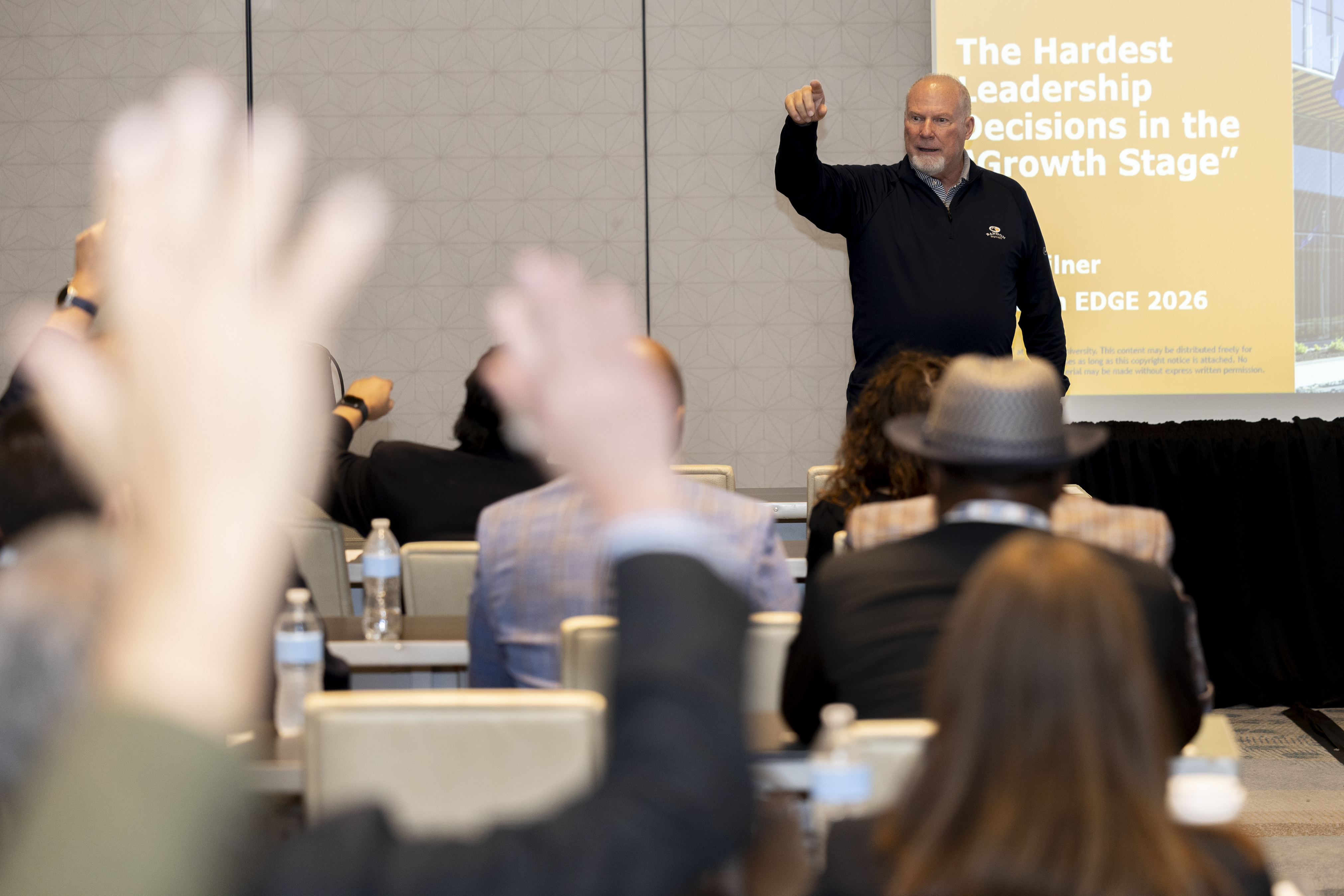 hands raised in session, edge 2026