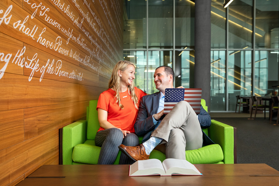 Military spouse smiling at her husband a SU college of law student.