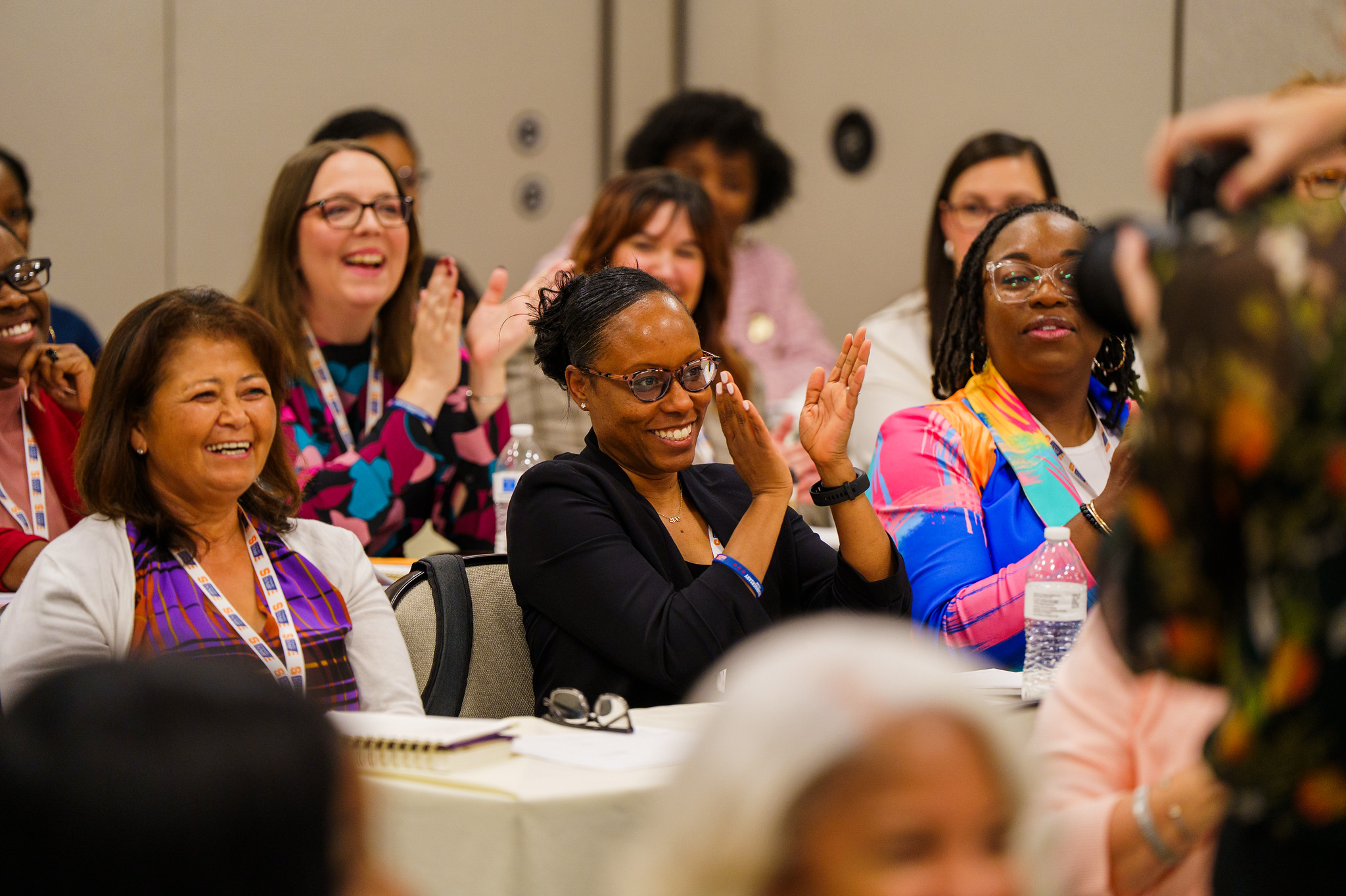 V-WISE Atlanta participants laughing and clapping. 