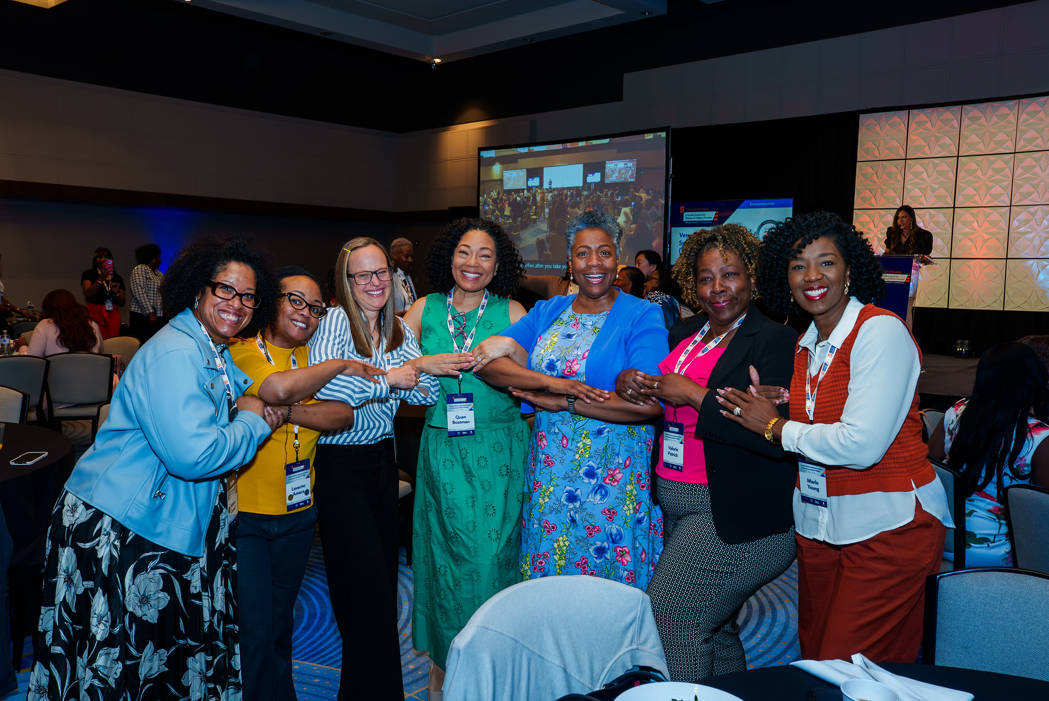 V-WISE atlanta participants joining hands and smiling. 