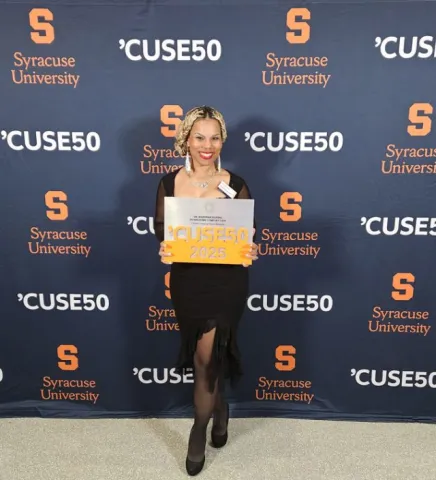 Dr Wakeena Dickens accepting her Cuse50 award. 