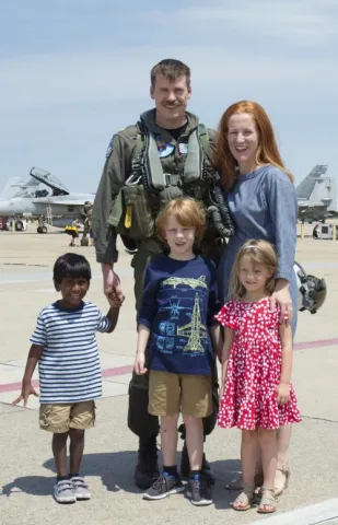Kate Johnson family at an airfield. 