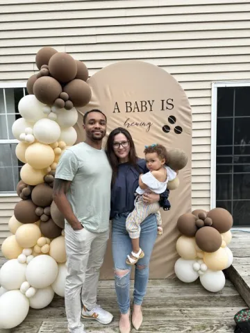 Sabina Lyszczarczyk pregnancy announcement with husband and first child. 