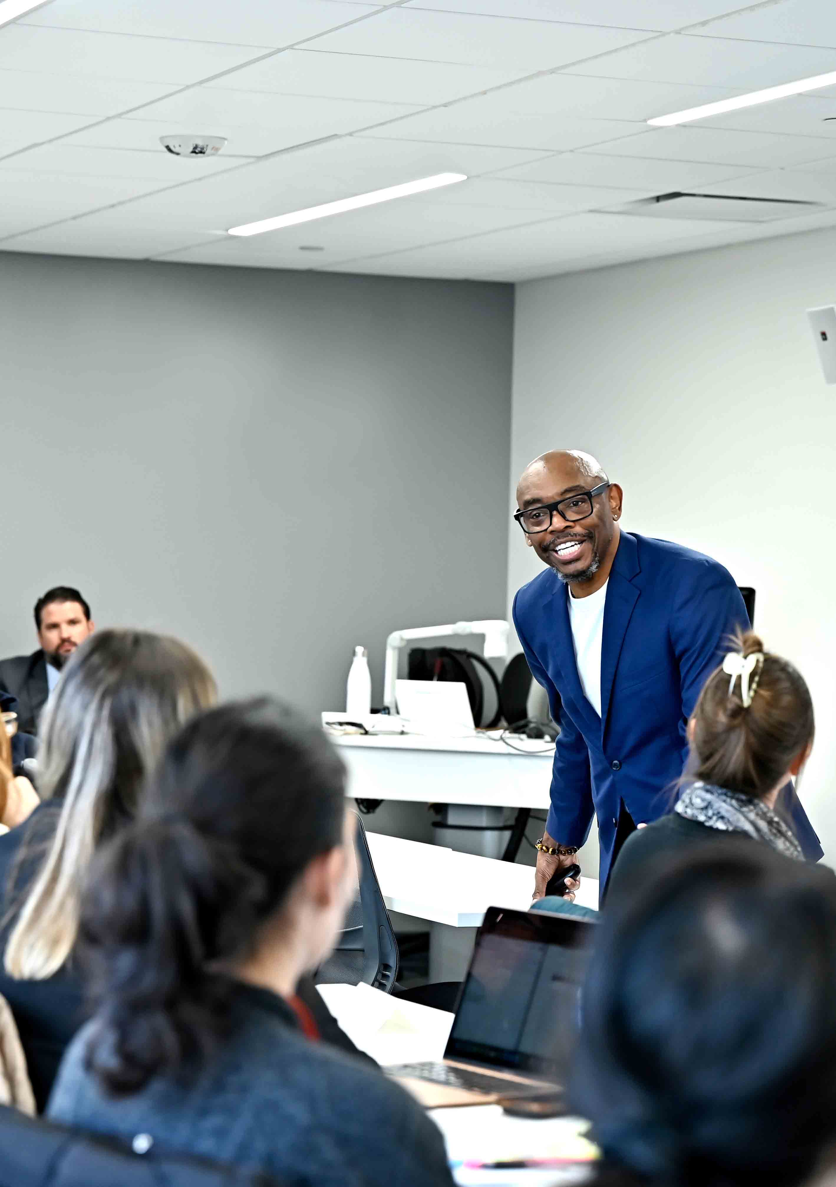 Speaker talks to students in a classroom for DC Voting Rights Residency