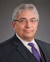LEE E. WOODARD