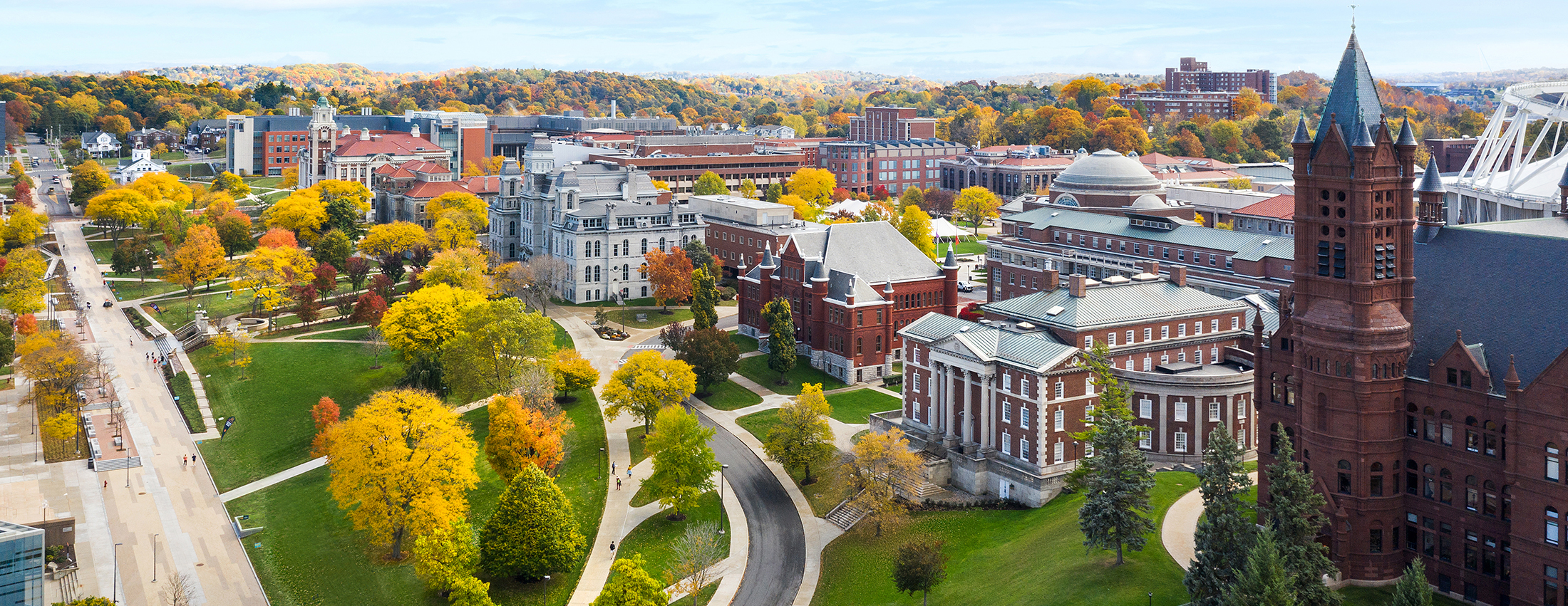 Fall on the Syracuse campus with main buildings and colorful fall leaves
