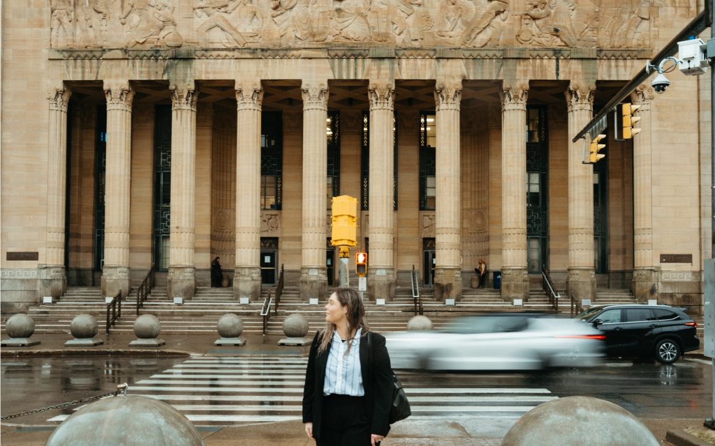Carly crossing the street