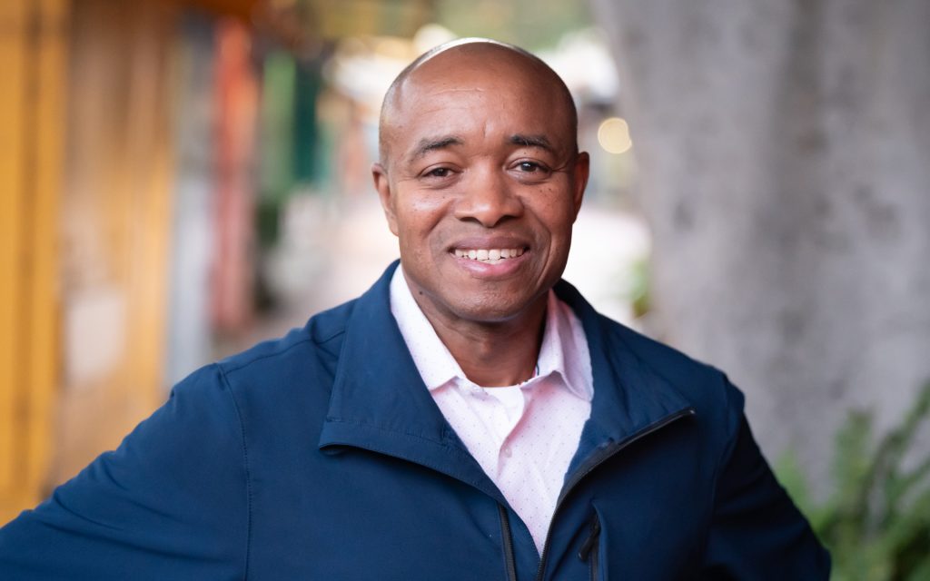 Charles Taylor smiles at the camera