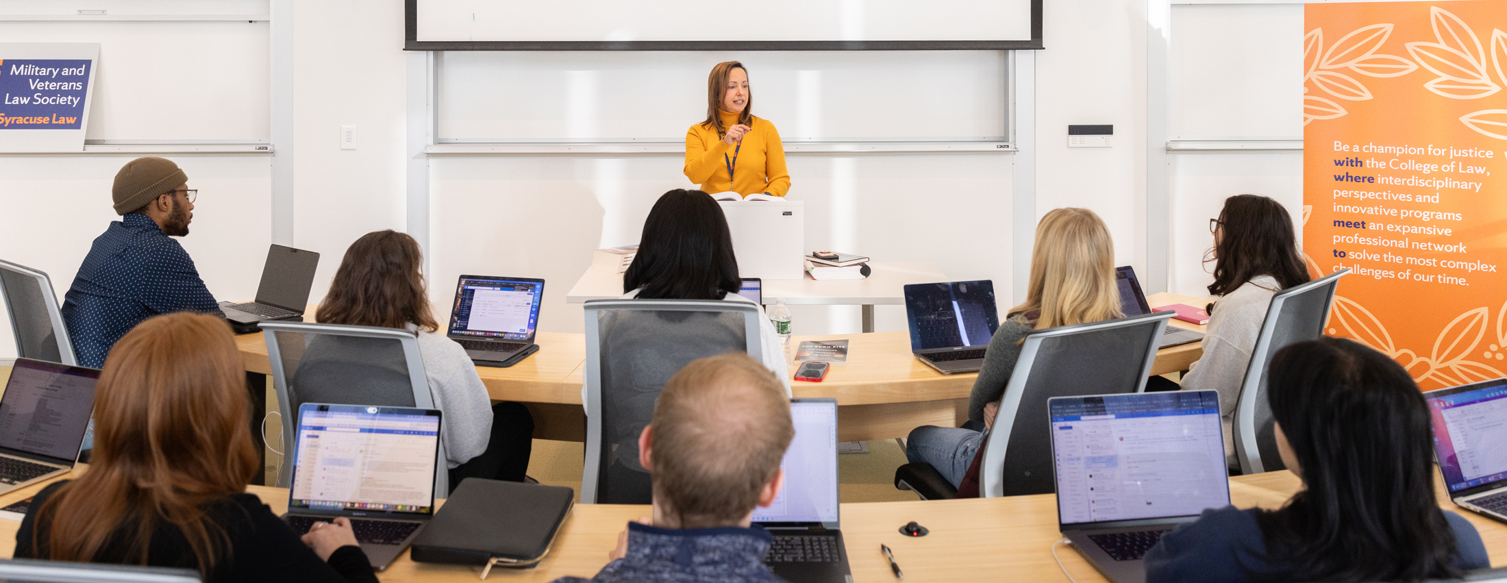 Professor teaching in a bright classroom