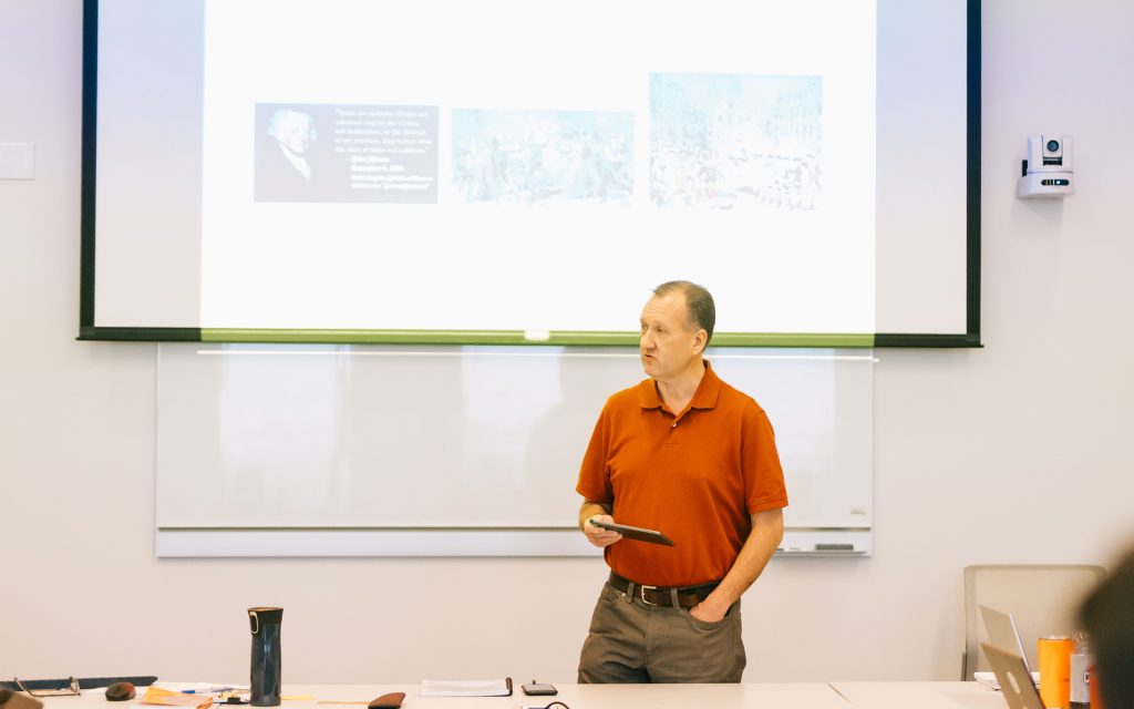 John presenting in a class during the January residency in Syracuse.