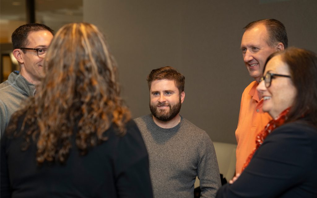 John chats with fellow students and faculty during the Online MBA and JDinteractive mixer.
