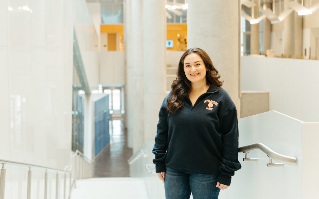 Alexis Gilman standing in Dineen Hall