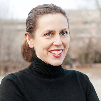 headshot of sarah roberts smiling in a black turtleneck outside