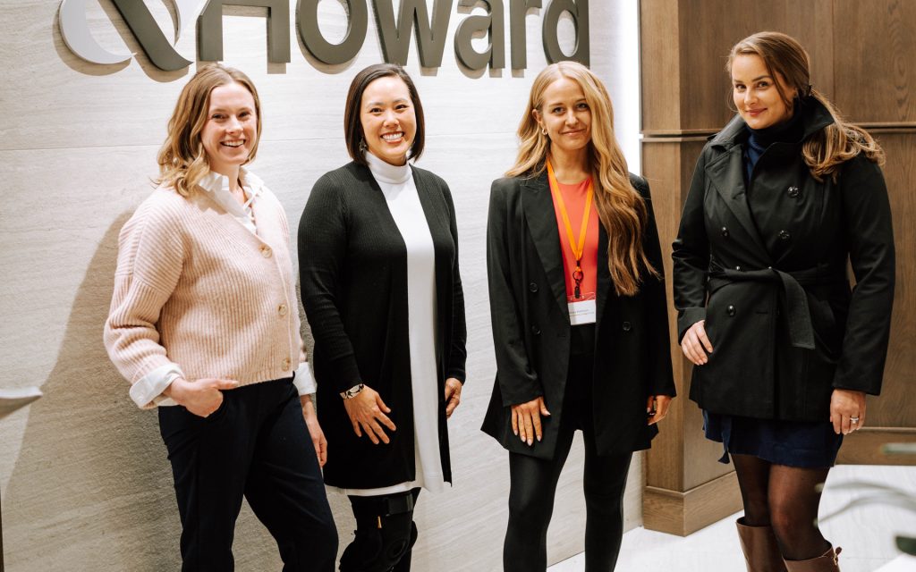 Amanda and classmates pose for a photo in front of the Sherman &amp; Howard sign during a residency in Denver
