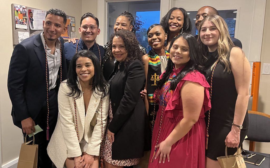 Suzette Melendez stands with a group of 9 others in the Latin American Students Law Association