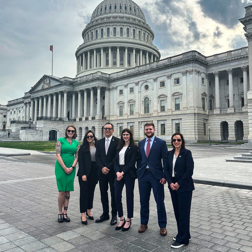 Students and faculty in front of the Capitol building