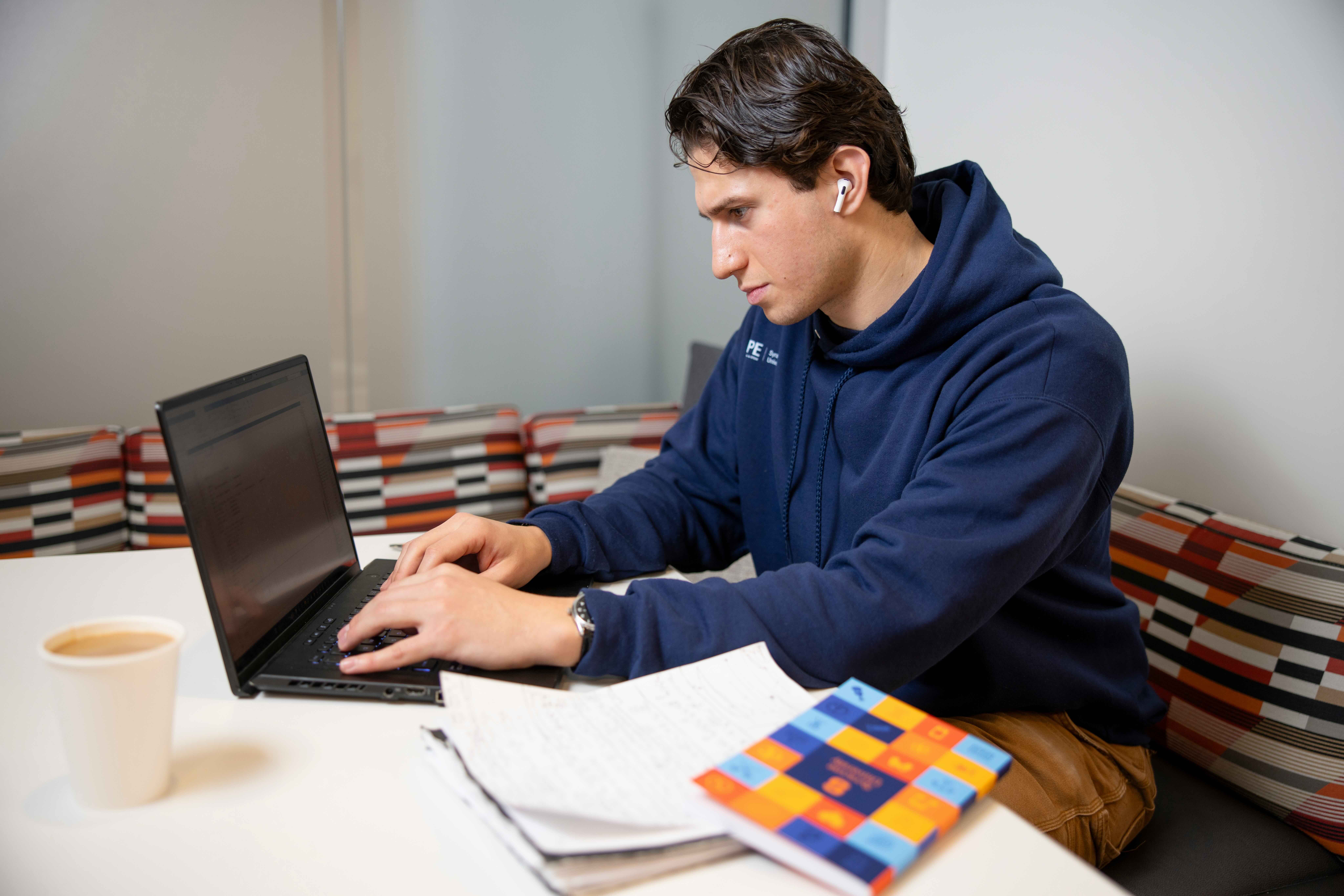 A student working on the computer. 