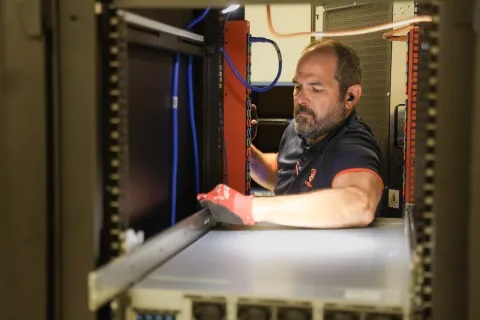 Man installing computer server