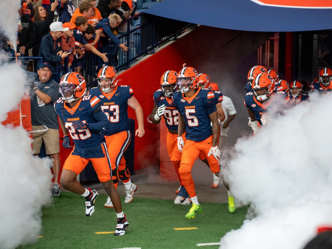 Syracuse football team runs out on to the field